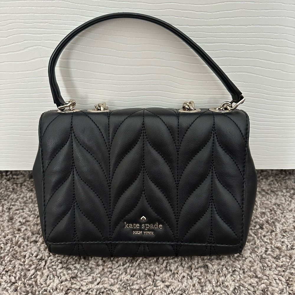 Kate spades black leather with silver chain